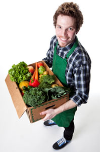 Person with a box of veggies