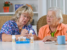 Worker helping older patient