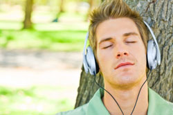 Person listening to headphones